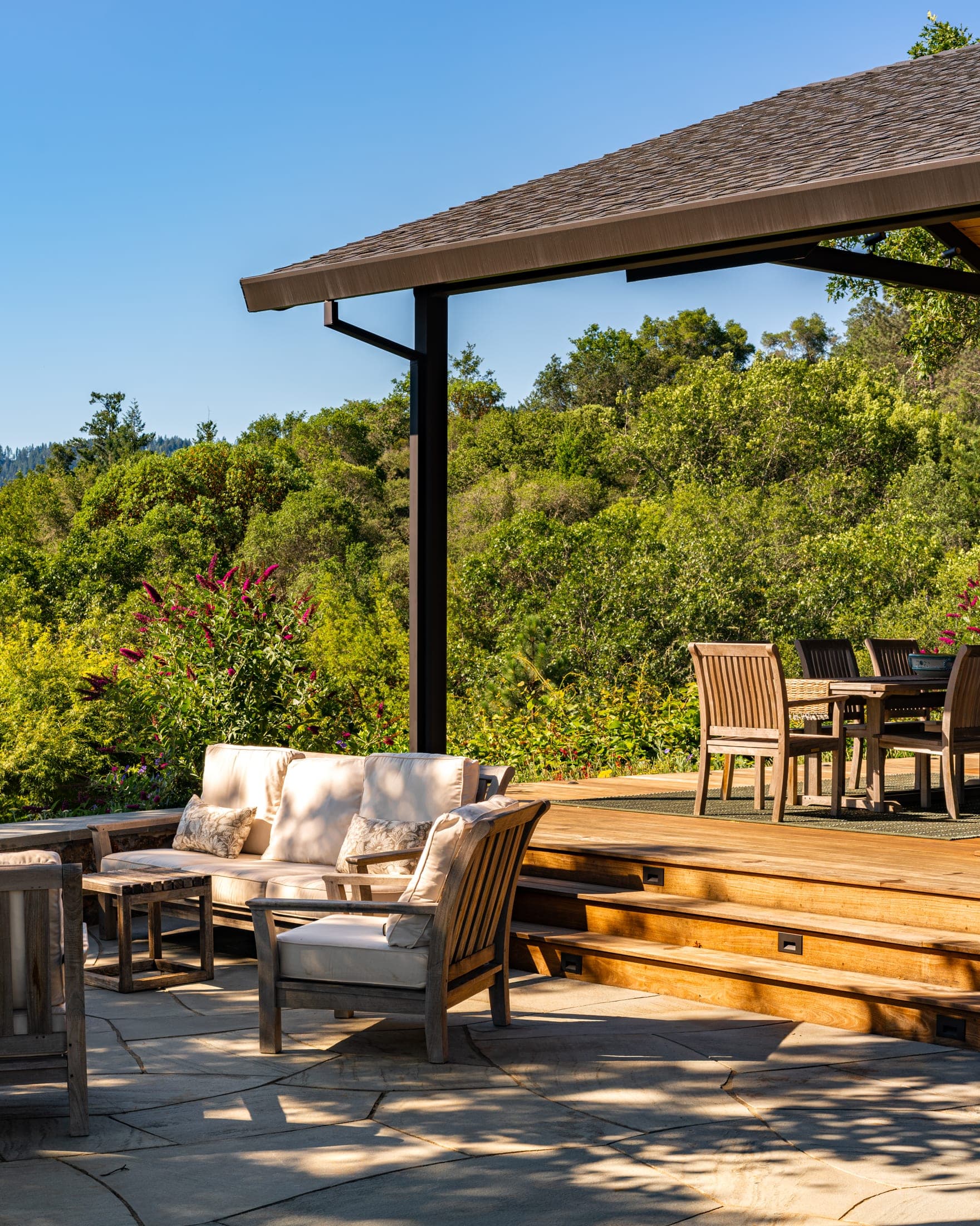Outdoor seating area surrounded by the garden