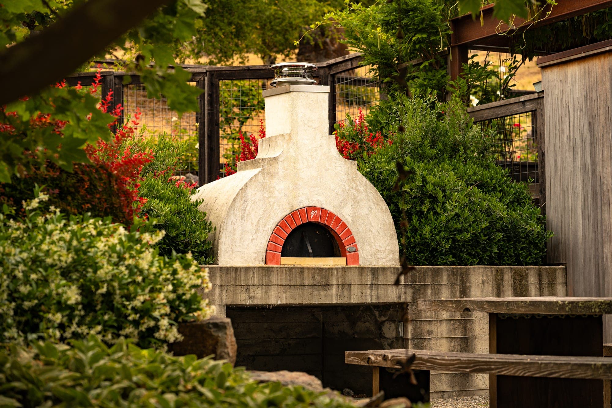 Outdoor oven and gathering area in the garden