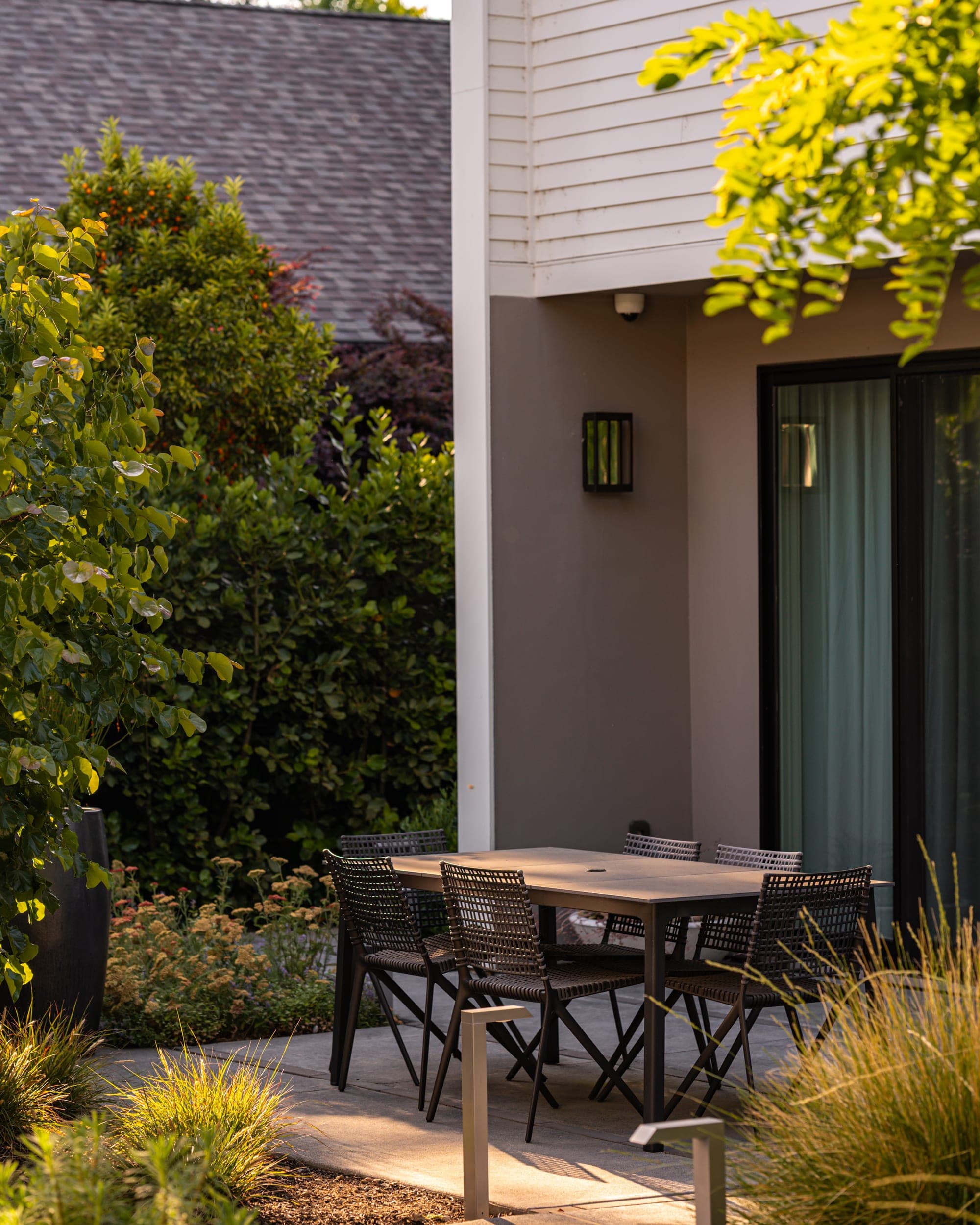 Outdoor dining patio beside the modern home